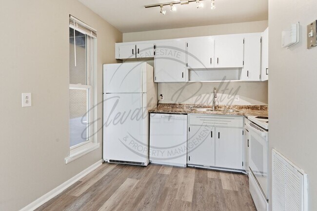 Building Photo - SPRING SPECIAL!! FIRST MONTH FREE on this ONE Bedroom Condo, First Floor, across from Madison Park!