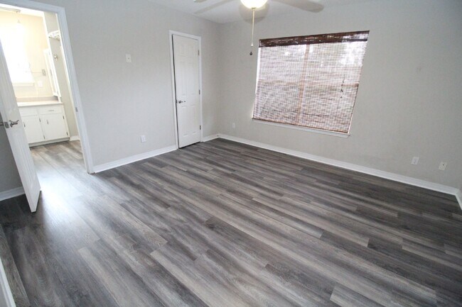 Building Photo - Live the Gulf Breeze Waterfront Life – Dock, Canal Access & Boat Lift!