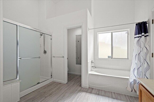 Building Photo - Multiple Living Areas 4-Bedroom Retreat with Vaulted Ceilings & No Carpet