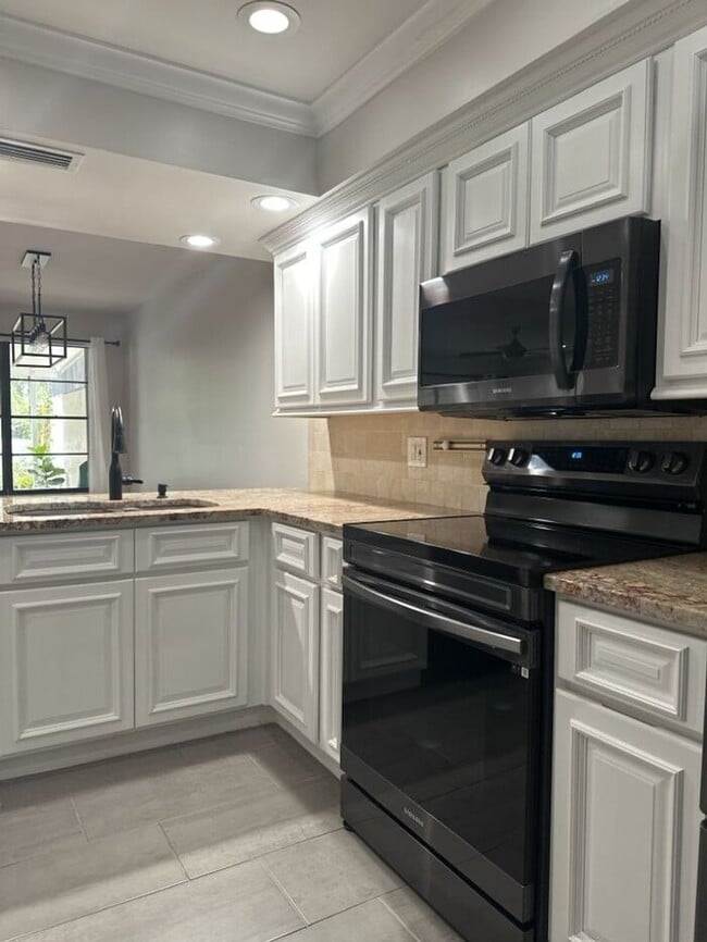 Building Photo - CARROLLWOOD VILLAGE REMODELED TOWNHOUSE