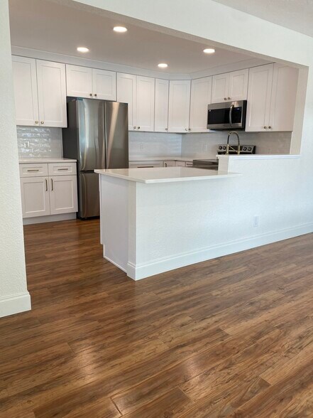 There is room for 2 barstools around the end of the counter. - 129 36th Ave NE