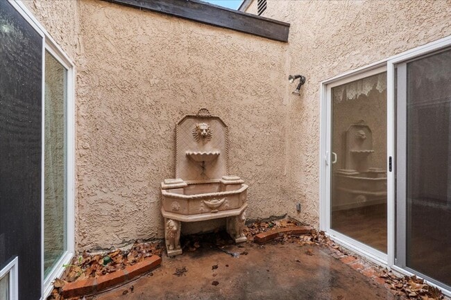 Building Photo - Private Street-Access Condo with Garage, Courtyard, Pool and Tennis