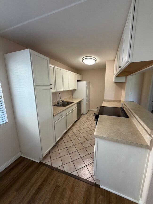 Building Photo - 2BR/1BA Lakeside ground floor condo with 1 car detached garage, 1 uncovered parking space & commu...