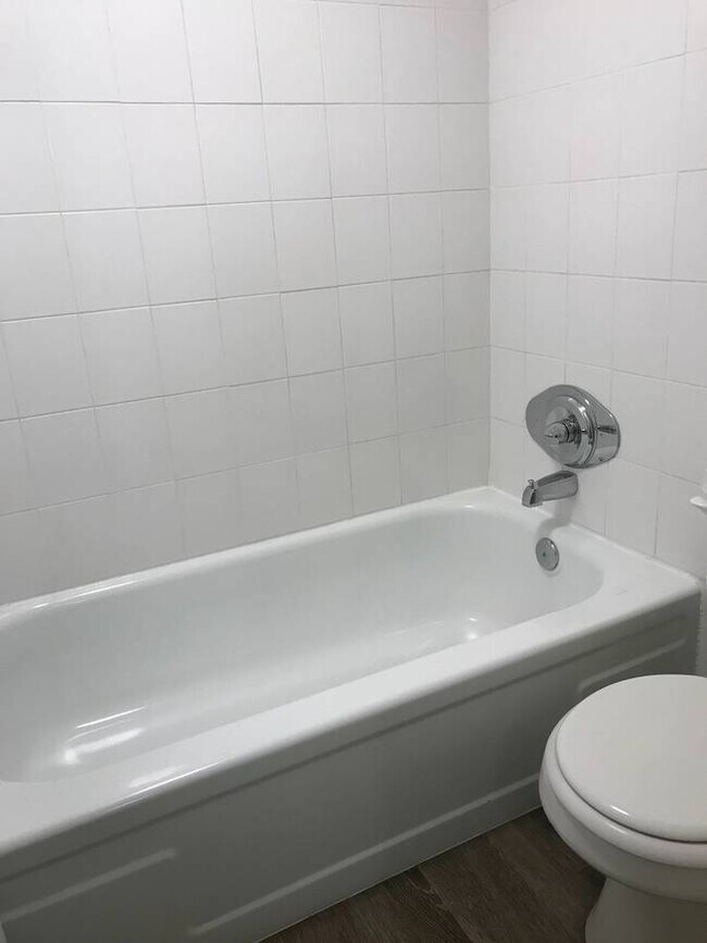 Experience a sleek and serene bathroom space with elegant fixtures. - 5381 Delaware