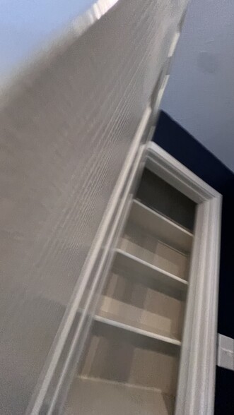 Upstairs living/media room closet - 18439 Rogers Bend