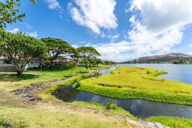 Building Photo - Lakeside, fully furnished, two bedroom, one bath townhome with enclosed garage.