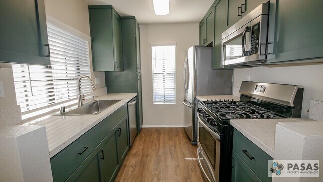 Building Photo - Bright Upgraded Condo w/ Quartz Kitchen, Covered Parking, Pool & Spa