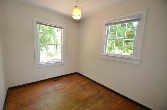Building Photo - Charming 2-Bedroom, 2-Bath Single-Family Home with Sunroom & Wooded Views