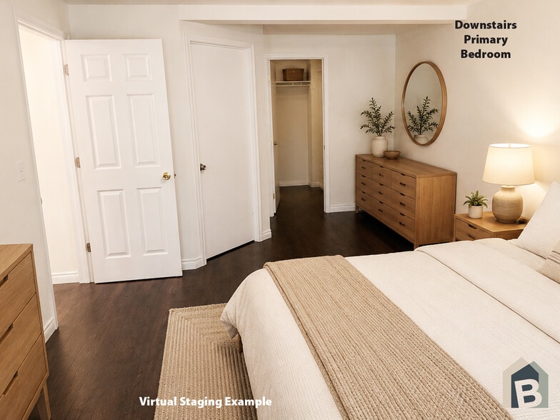 1st floor primary en-suite with large walk-in closet and view of lawn and mature evergreen trees - 20981 Port Gamble Rd NE