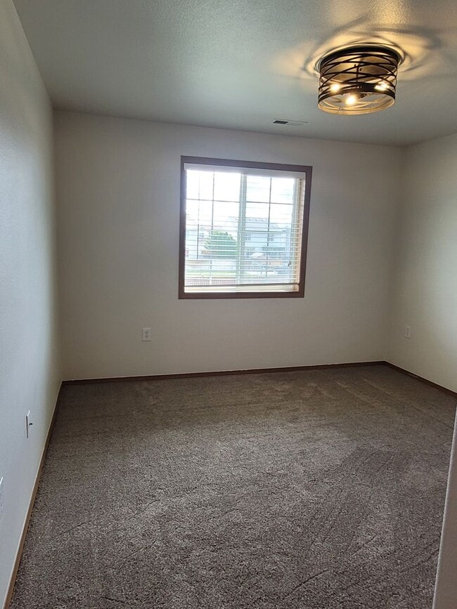Building Photo - August Rent FREE - 4 Bedroom / Triple Car Garage