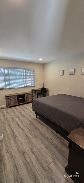 Spacious bedroom with a comfortable queen-size bed. - 503 Yorkshire Dr