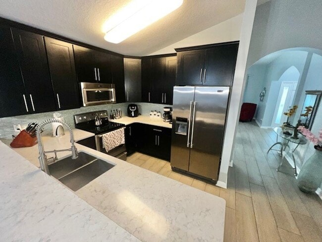 Building Photo - Amazing 4x2 in Lake Nona!! Gated Nona Crest! All tile flooring!! 2 car garage!