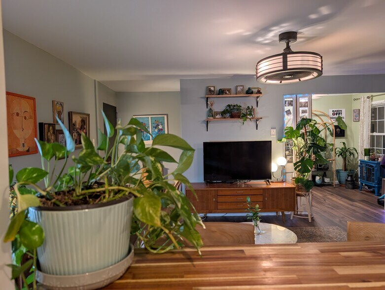 View from open kitchen to living room and den - 12709 Gordon Blvd
