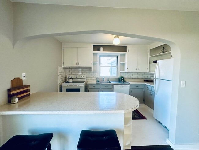 Building Photo - {8520} Charming Four Bedroom in Fantastic Location + Two Main Floor Bedrooms + Hardwood Floors + ...