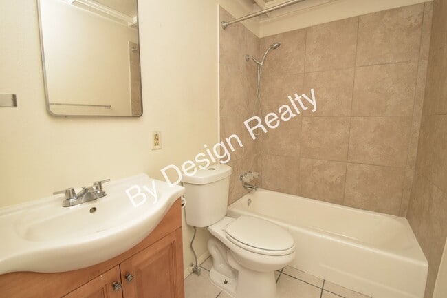 Building Photo - Sun-Drenched Mid-Century Living Near Garden District