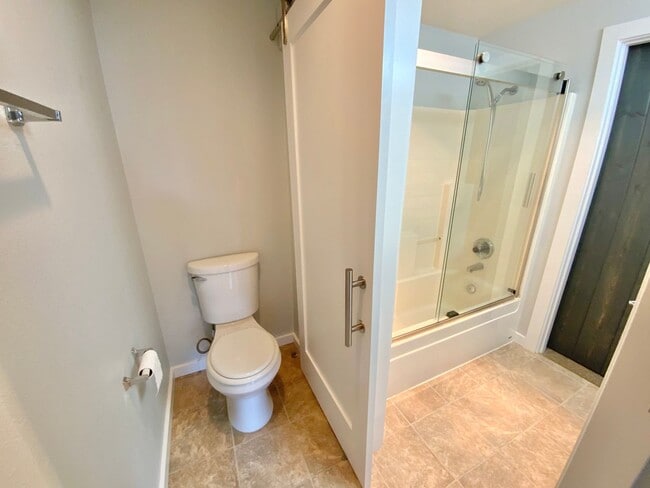 Building Photo - Large Updated 2 Bed, 1.5 Bath Townhouse w/ Washer & Dryer + Off-street Parking