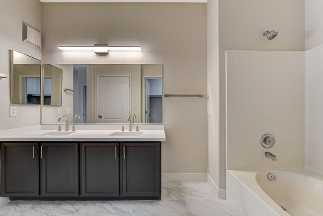 Building Photo - Upgraded First-Floor Condo in a Gated Summ...