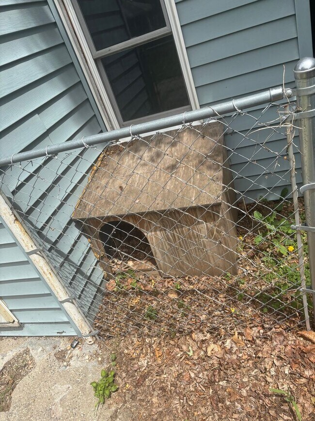 Building Photo - Perfect Home for You and Your Pup! Dog House Included + Fenced Yard