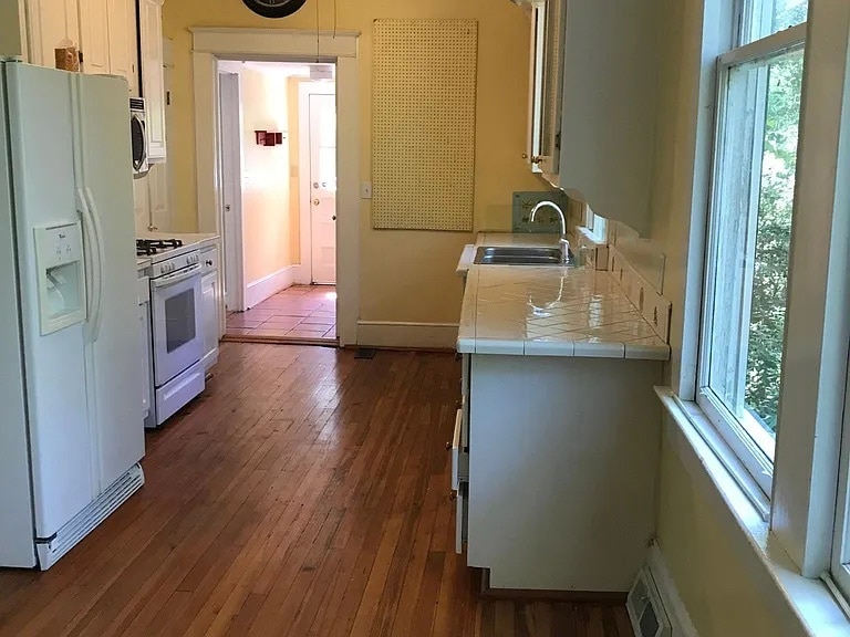 Kitchen from eat in area. - 1203 Woodrow St