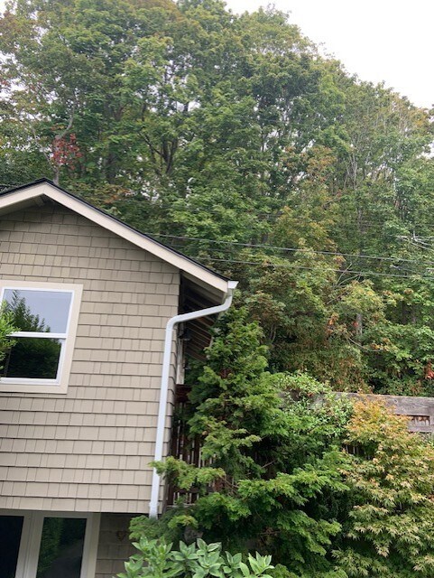 Back side of 1 car garage and storage, plus 2 parking stalls in front of house - 7117 Beach Dr SW