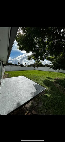 Backyard that includes Lawn Service - 312 Poinsetta Dr