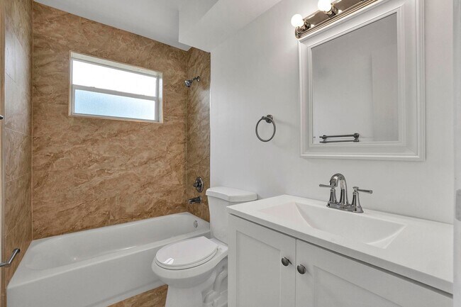 Building Photo - Sunrise Gem: Updated 2-Bed, 2-Bath with Garage Parking