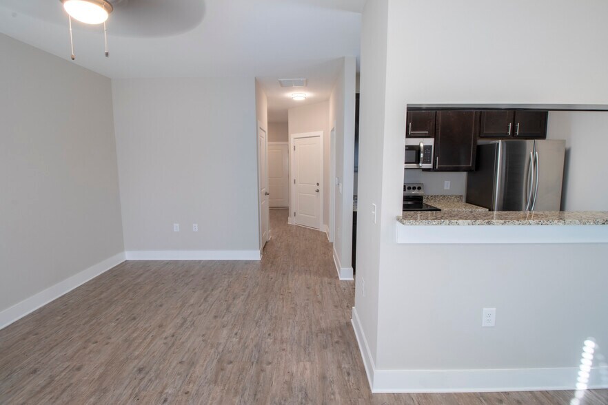 Partial view of L-shaped living/dining area - 230 Signature Pl