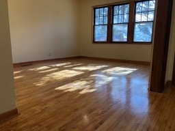 Spacious living room with refinished maple floors - 509 E Vernon Ave
