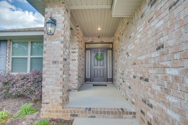 Building Photo - Spacious 4BR/2BA Brick Home with 2-Car Garage, Granite Kitchen, Vaulted Ceilings & Fully Fenced B...