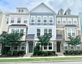 Building Photo - 3 Story Townhome 3 Bedrooms Rear Entry 2 Car Attached Garage with 1st Floor Bedroom, Community Po...