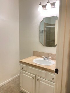 1st bathroom w/ travertine tiles - 10481 Riverside Dr
