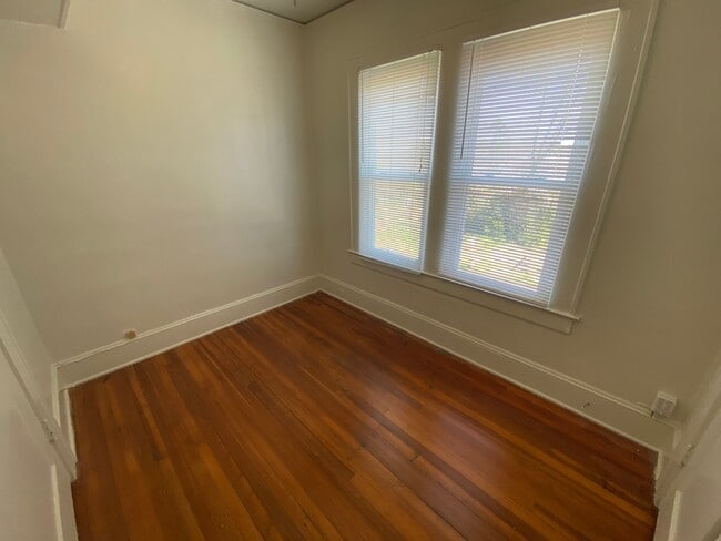 Building Photo - Huge Trinity Park Duplex with Office, Shared Fenced Yard and Adorable Porch!