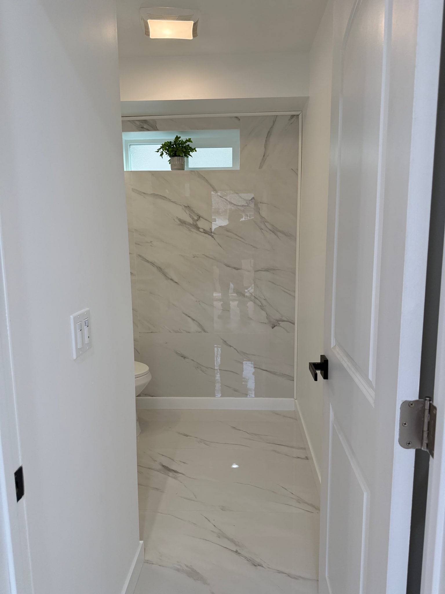 Entry to powder room - 4253 Raynol St