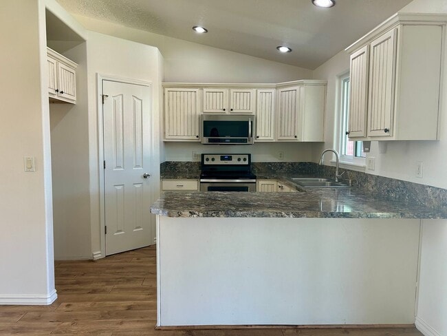 Building Photo - Spacious 4-Bedroom Home with RV Parking & No Backyard Neighbors