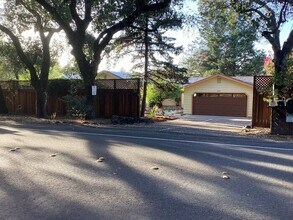 Building Photo - Look No Further, this home has it all- Hot Tub, Sauna, EV Charger, Solar, KOI Pond & More