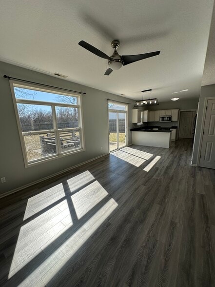 Dining Room + Kitchen + Back Patio Entrance - 411 Treeline Cv