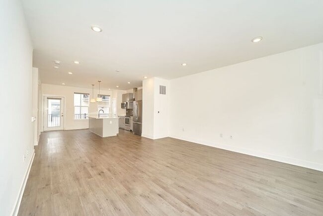 Building Photo - Like New Townhome With Your Own Rooftop Views of Downtown Indy!