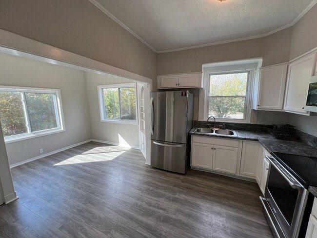 Building Photo - Coming soon! Updated 4-Bedroom Home with Plenty of Living and Storage Space.