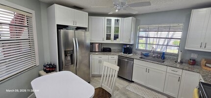 Building Photo - Welcome to **Caloosa Yacht & Racquet Club**, one of Fort Myers’ most charming **gated waterfront ...