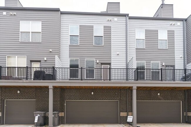 Building Photo - Like New Townhome With Your Own Rooftop Views of Downtown Indy!