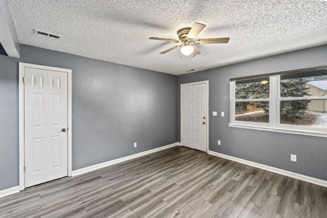 Building Photo - Charming Two-Story Home with Fenced Yard & Cozy Fireplace — Pet-Friendly!