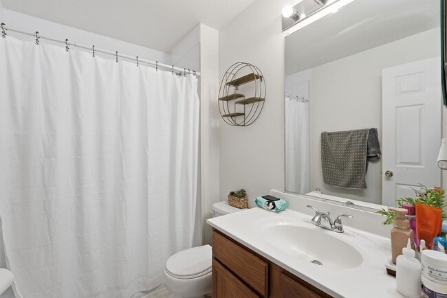 Building Photo - Bathed in natural light, this stunning second level condominium offers an effortless blend of com...