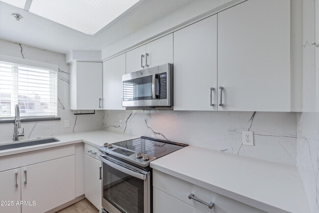 Building Photo - 9450 E Becker Ln