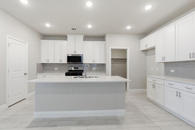 Building Photo - "Open-Concept 4-Bedroom, 2.5-Bath with Designer Finishes and Peaceful Greenbelt Views!"