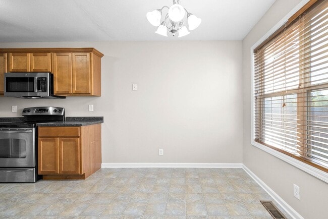 Building Photo - Pet Friendly Three Bedroom with Bonus!