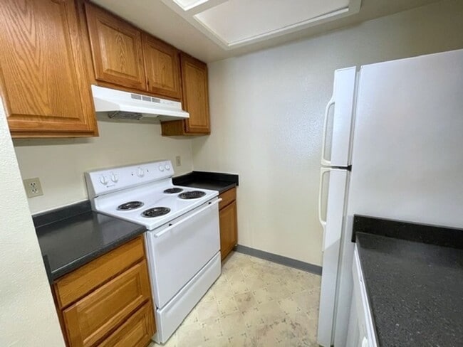 Building Photo - East Anchorage Condo with Laminate Floorin...