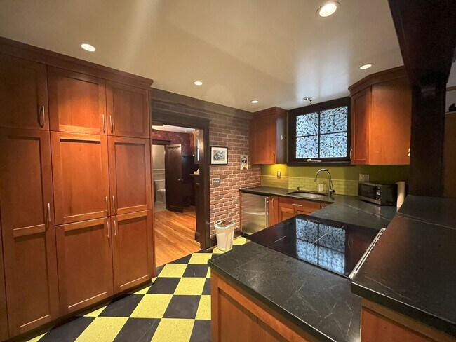 Building Photo - Charming NW Portland 1-Bedroom with Brick Accents & Modern Touches