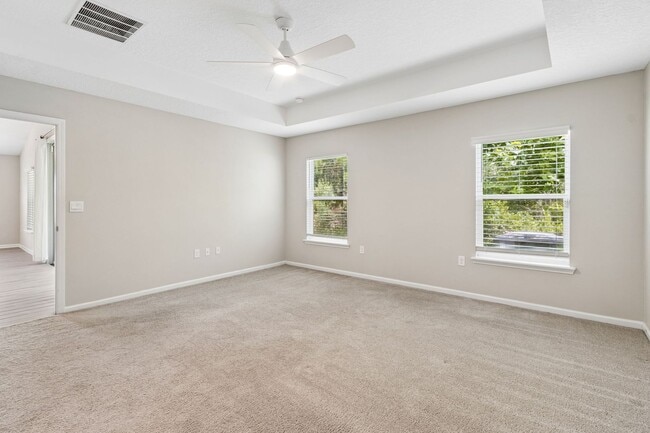 Building Photo - Modern 4BR Home with 3 Full Baths in River Glen | Screened Porch & Resort-Style Amenities