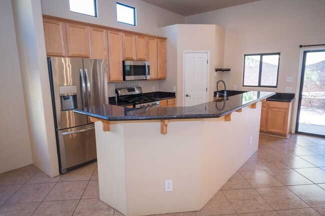 Building Photo - Gorgeous 3 Bedroom 2 Bathroom Home with Tile Throughout! Central A/C, 2 Car Garage!