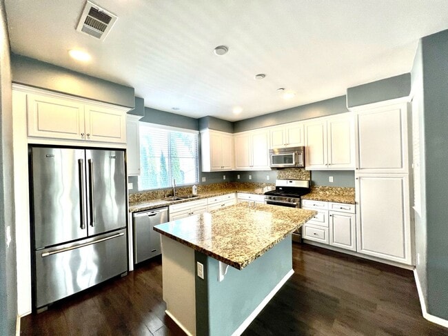 Building Photo - Beautiful 4 Bedroom Condominium with Attached Garage Located in Gated Community of Eastvale